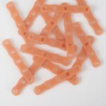 Bulk pile of thermochromic silicone perm rubber bands, hair styling supplies
