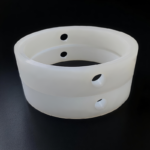 Molded rubber butterfly valve seat with mounting holes
